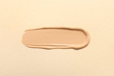 Bej arka plan, üst görünüm cilt temeli lekesi