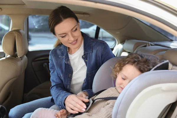 Mother Fastening Her Sleeping Daughter Child Safety Seat Car — Stock Photo, Image