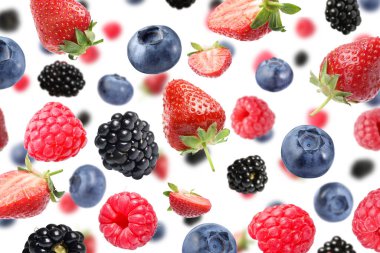 Beyaz arka planda uçuşan bir sürü farklı meyve.