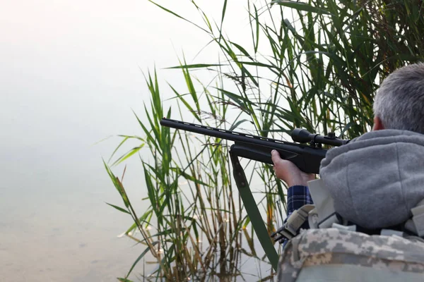 Man Aiming Hunting Rifle Lake Outdoors Closeup Space Text — Stock Photo, Image