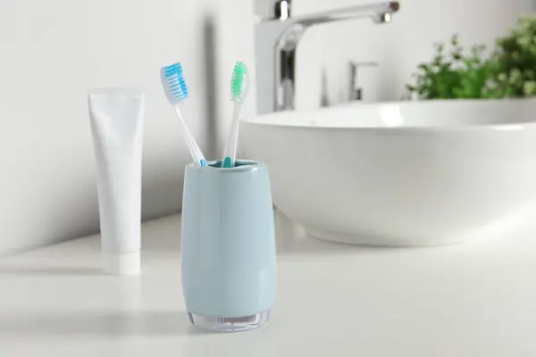 Plastic Toothbrushes White Countertop Bathroom Space Text — Stock Photo, Image