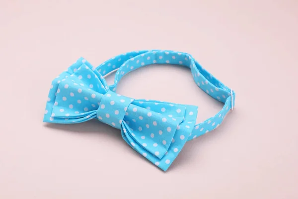 Stylish Light Blue Bow Tie Polka Dot Pattern Beige Background — Stock Photo, Image