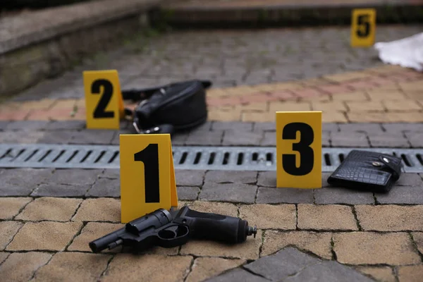 Crime scene markers and evidences outdoors, closeup