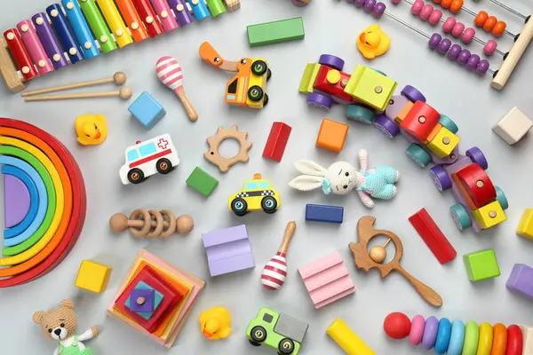 Brinquedos Infantis Diferentes Fundo Cinza Claro Flat Lay — Fotografia de Stock