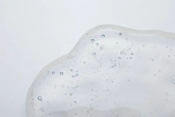 Sampel Minyak Kosmetik Pada Latar Belakang Krem Closeup — Stok Foto
