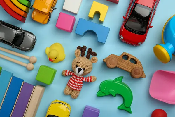 Verschiedene Kinderspielzeuge Auf Hellblauem Hintergrund Flach Gelegt — Stockfoto