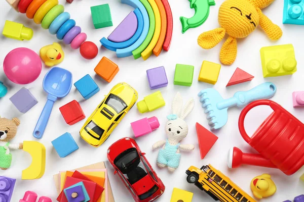 stock image Different children's toys on white background, flat lay