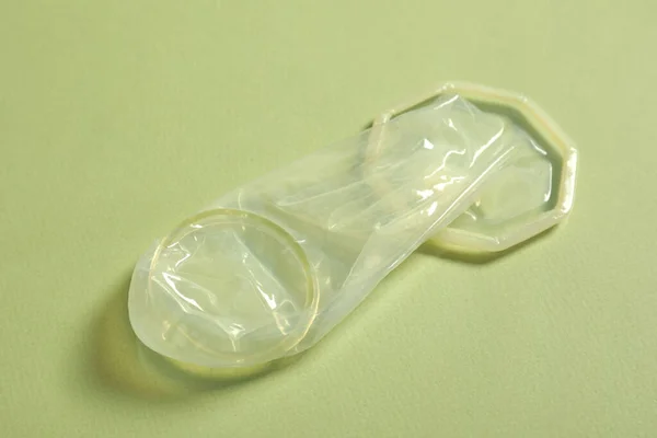 Unrolled Female Condom Light Green Background Closeup Safe Sex — Stock Photo, Image