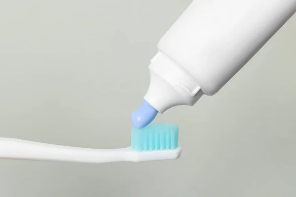 Applying Paste Toothbrush Grey Background — Stock Photo, Image