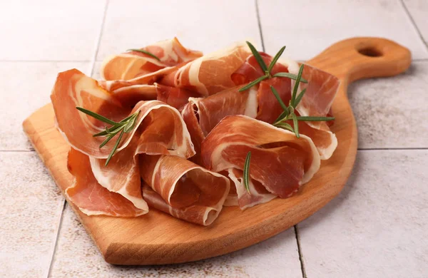 Slices Tasty Cured Ham Rosemary Tiled Table Closeup — Stock Photo, Image