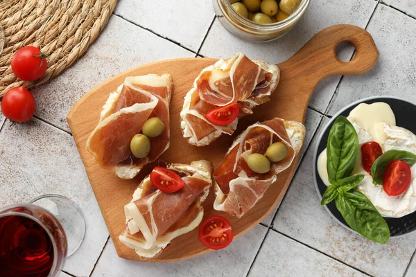 Tasty Sandwiches Cured Ham Tomatoes Olives Tiled Table Flat Lay — Stock Photo, Image