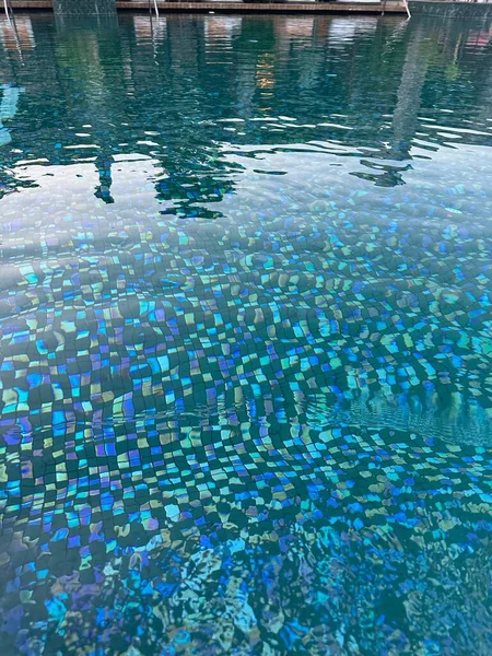 Clear refreshing water in outdoor swimming pool