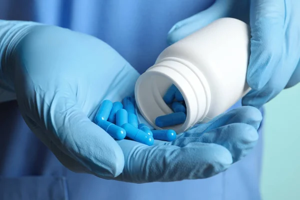 Doctor Pouring Pills Bottle Hand Turquoise Background Closeup — Stock Photo, Image