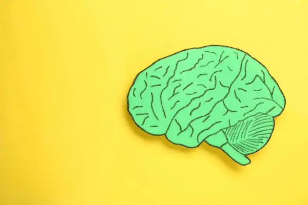 Paper Cutout Human Brain Yellow Background Top View Space Text — Stock Photo, Image