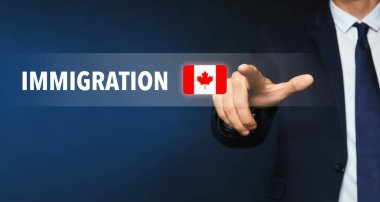 Immigration. Businessman touching digital screen with word and flag of Canada on dark blue background, closeup clipart