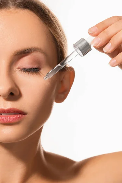 Woman Applying Cosmetic Serum Her Face White Background Closeup — Stock Photo, Image