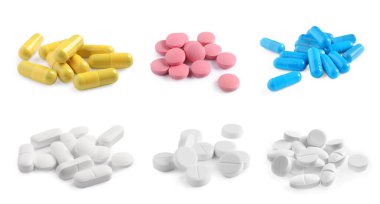 Beyazın üzerine izole edilmiş farklı haplar.