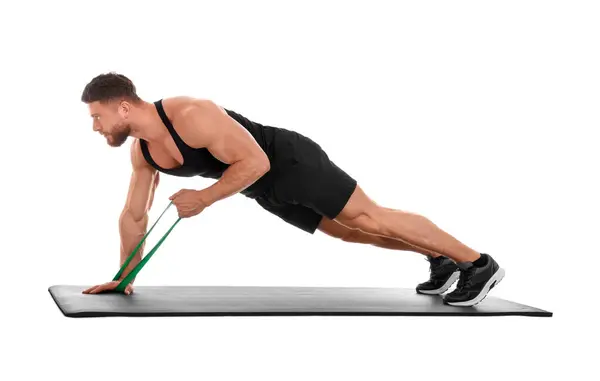 Mladý Muž Cvičení Elastickou Odolnost Pás Fitness Podložku Proti Bílému — Stock fotografie