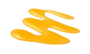 Beyaza izole edilmiş taze bal dökülmüş.