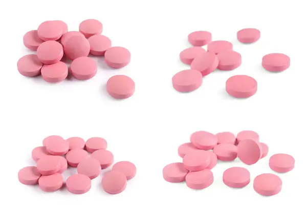 一堆堆粉红色药丸隔离在白色上 — 图库照片