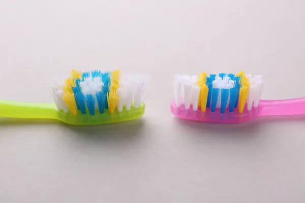 Colorful Plastic Toothbrushes Light Background Closeup — Stock Photo, Image