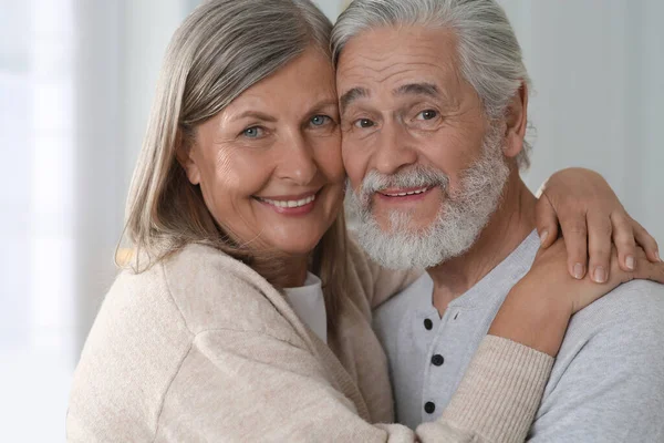 Portrait of affectionate senior couple at home