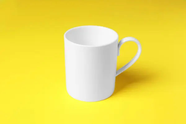 One White Ceramic Mug Yellow Background — Stock Photo, Image
