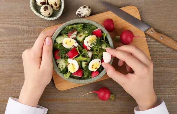 Woman Adding Piece Radish Salad Wooden Table Top View — Stock Photo, Image