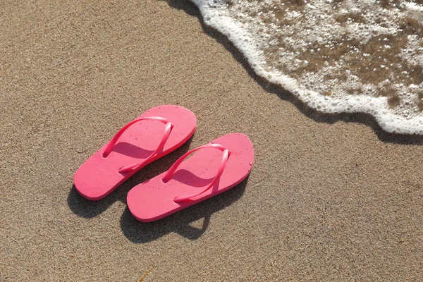 Stylish Bright Pink Flip Flops Sand Sea View Space Text Stock Image
