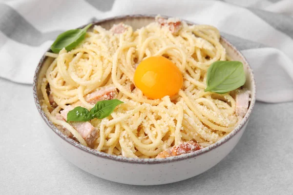 Bowl Tasty Pasta Carbonara Basil Leaves Egg Yolk Light Grey — Stock Photo, Image