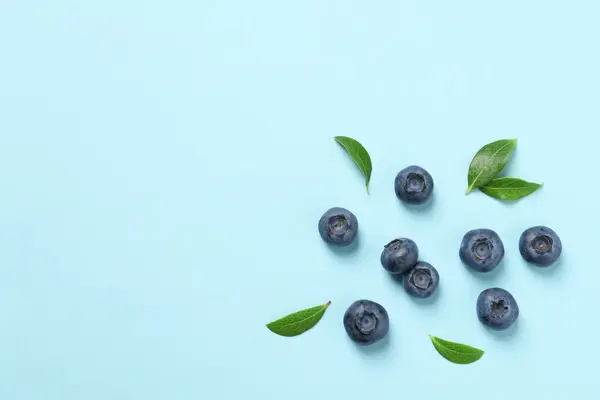 Tasty Fresh Blueberries Green Leaves Light Blue Background Flat Lay — Stock Photo, Image