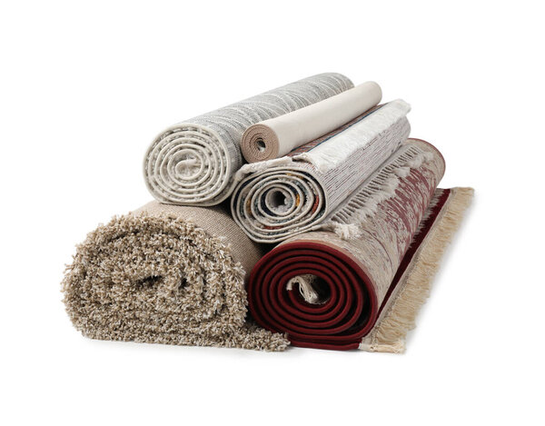 Rolled carpets on white background. Interior element