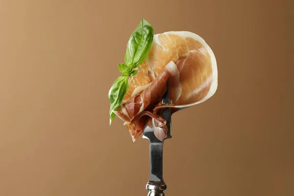 Fork Slice Tasty Jamon Basil Leaves Brown Background Closeup — Stock Photo, Image