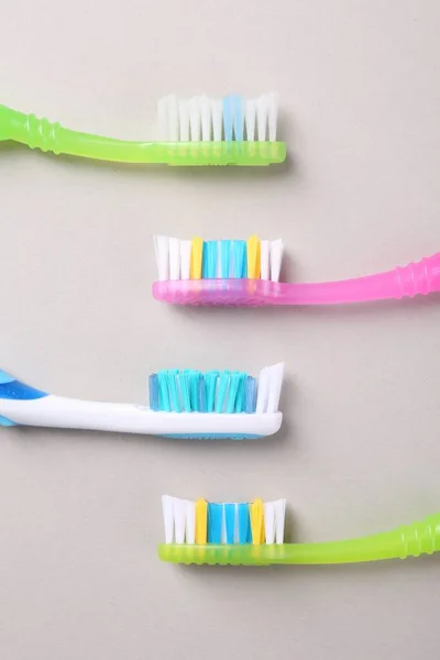 Many Different Toothbrushes Light Background Flat Lay — Stock Photo, Image