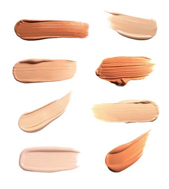 Beyazda izole edilmiş çeşitli deri tipleri için farklı dokuların ve tonların temeli. Makyaj ürünü örnekleriyle ayarlandı