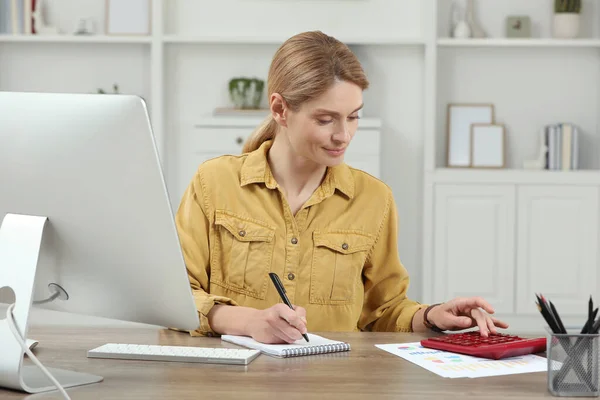 stock image Professional accountant working at wooden desk in office