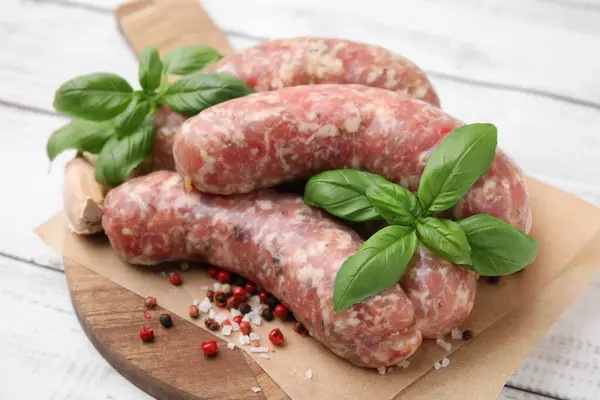 Raw Homemade Sausages Different Spices White Wooden Table Closeup — Stock Photo, Image