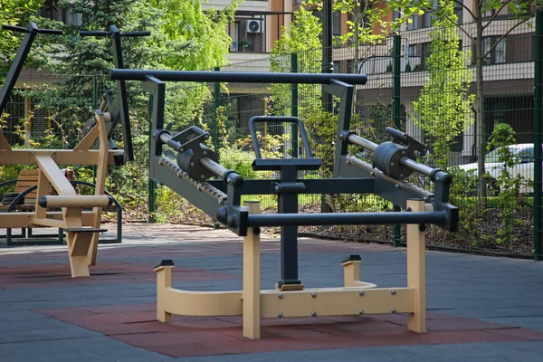 Empty outdoor gym with exercise simulator in residential area