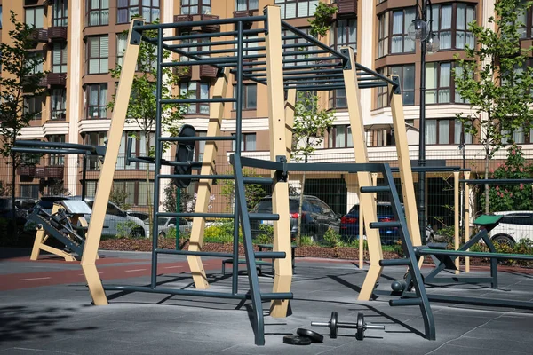 Empty outdoor gym with different sport simulators in residential area