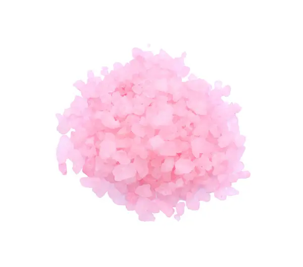 Heap of pink sea salt isolated on white, top view
