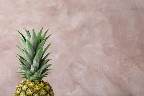 Delicious ripe pineapple on pink background. Space for text