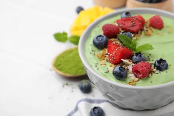 Tasty Matcha Smoothie Bowl Served Berries Oatmeal White Table Closeup — Stock Photo, Image