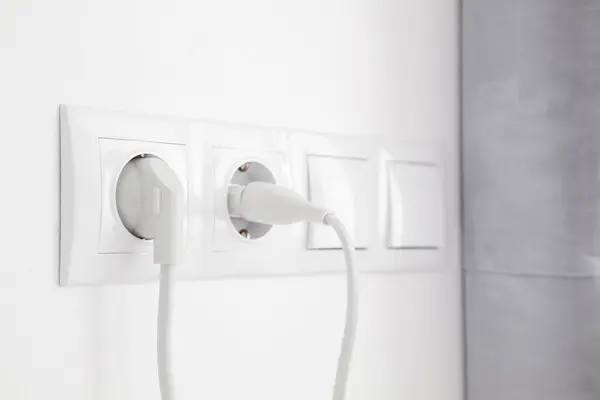 Power Sockets Inserted Plugs Light Switches White Wall Indoors — Stock Photo, Image