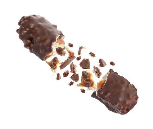 배경에 공기에서 카라멜 부서진 초콜릿 — 스톡 사진