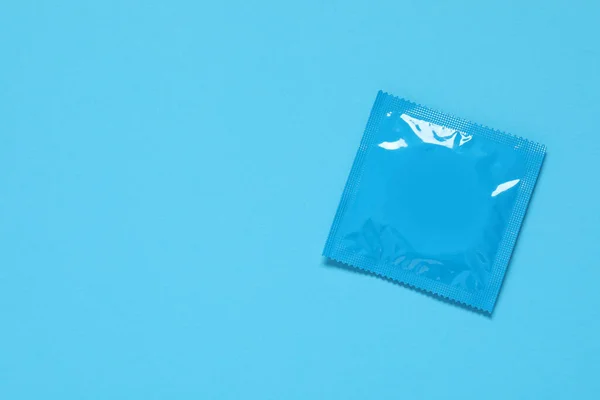 Condom Package Light Blue Background Top View Space Text Safe — Stock Photo, Image