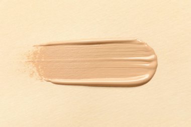 Bej arka plan, üst görünüm cilt temeli lekesi