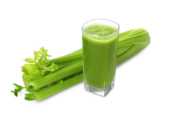 Glass of celery juice and fresh vegetable on white background