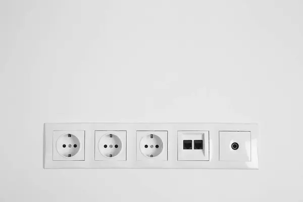 Many Power Sockets Ethernet Coax Plates White Wall Indoors Space — Stock Photo, Image