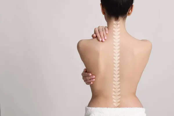 stock image Woman with healthy back on light background, space for text. Illustration of spine