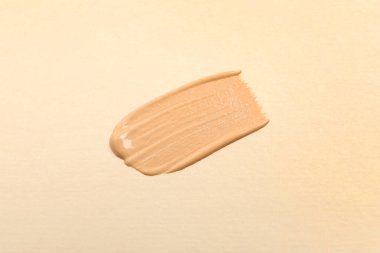 Bej arka plan, üst görünüm cilt temeli lekesi